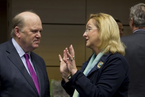Finance Minister Michael Noonan, left, speaks with Austria's Finance Minister Maria Fekter during a meeting of EU finance ministers in Brussels on Wednesday.