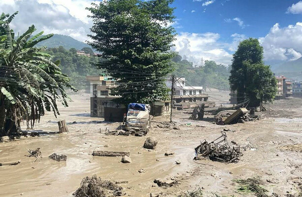 Massive flood tears through Nepal-Tibet border, leaving at least 19 dead and hundreds missing