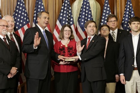 Speaker John Boehner, left, holds a mock 'swearing-in' ceremony for Tennessee congressman Chuck Fleischmann on the first day of the new Congress.