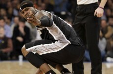 NBA player sprains ankle after tripping on a waitress taking New York mayor's drink order at a Knicks game