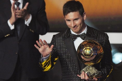 Argentina's Lionel Messi poses with the trophy after winning the FIFA Men's World Player of the Year Award.