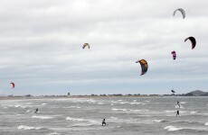 Kite surfer rescued after becoming separated from his board