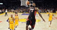 A perfectly-timed photo of LeBron James dunking on the Lakers last night