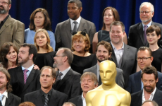 Who is the woman wearing cat ears in the Oscar Nominees photograph?