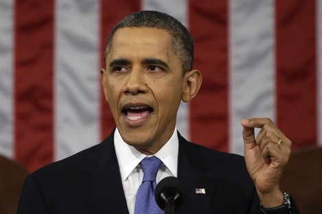 President Barack Obama gestures as he gives his State of the Union address.