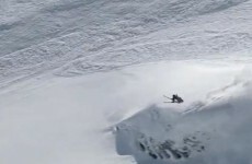 VIDEO: Skier does backflip despite being chased by an avalanche he caused