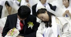 PICS: Thousands marry (and some snooze) at South Korean mass wedding