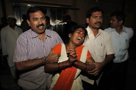 An Indian woman Sujatha, wails after seeing her husband Venkateshwarulu's body, unseen, killed in bomb blast, 