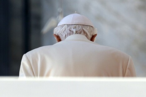 The Pope, hunching over to check his really annoying Twitter mentions