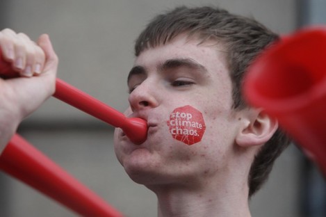 A member of protest group Stop Climate Chaos outside Leinster House in late 2011.