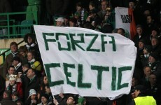 Celtic and Juve fans exchange scarves on the terraces in Turin