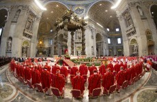 Why do Catholic cardinals wear scarlet for the conclave?