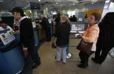 With limits on cash withdrawals, Cypriot banks reopen calmly