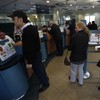 With limits on cash withdrawals, Cypriot banks reopen calmly