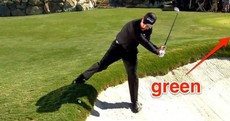 Phil Mickelson hits a ball onto the green while facing the opposite direction in another sick trick shot