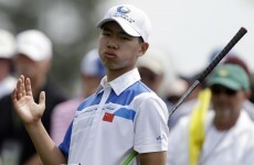 14-year-old Guan Tianlang pings an approach to 5-feet at US Masters