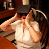 Here is a 90-year-old woman in a virtual reality helmet