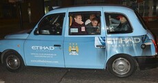 Taxi for City... Man United players ride around town in sky blue cab