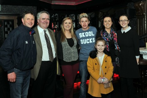 Niall Horan (in the 'Skool Sucks' top), Willie Penrose (beige suit), and pals 