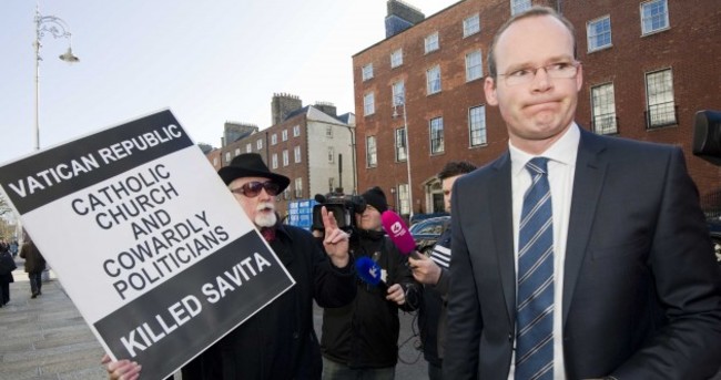 PICS: Cabinet meets protester on way into crucial meeting on abortion