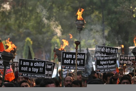 Activists protest against the rape of another young girl (5) in New Delhi, India.