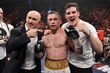 Frampton celebrates his European title win with Barry McGuigan, left, and trainer Shane McGuigan.