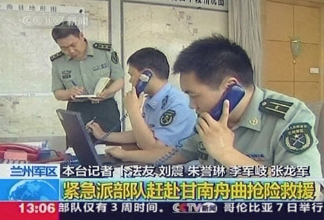 n this image made from TV footage, Chinese soldiers deal with phone calls in Lanzhou Military Zone at Langzhou, China's Gansu province, today.