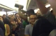 Passengers stuck on overheated plane take dramatic action