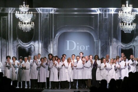 Dior fashion house employees acknowledge applause at the end of the Fall-Winter 2012 ready to wear collection today.