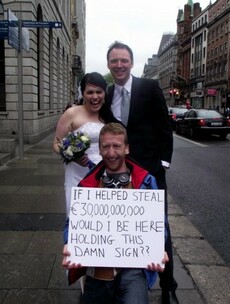 Newlyweds take photos at Anglo protest