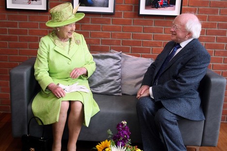 Queen Elizabeth II meets Irish President Michael D. Higgins during a visit to the Lyric Theatre in Belfast.