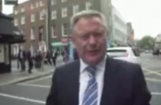 Video: Howlin angrily pushes camera away as he is confronted over bank inquiry