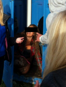 Girl falls face first into festival portable toilet