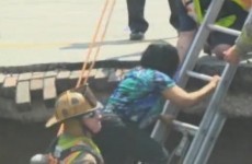 Video: Dramatic rescue after woman's car swallowed by sinkhole