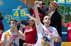 Man scoffs 69 hot dogs, breaking own record