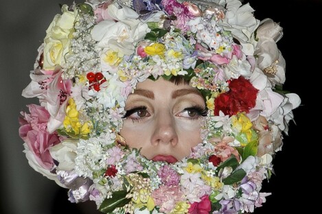 Presumably the crown of flowers is to soften the stench.