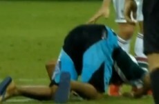 Fluminense fan invades the pitch to bow down and kiss Fred's feet