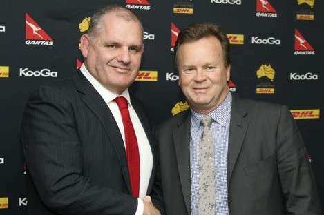 Ewen McKenzie, left, and Australian rugby union CEO Bill Pulver, right, shake on it.