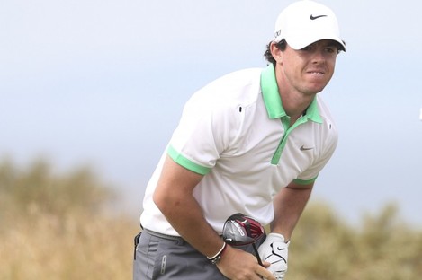 Rory McIlroy reacts to a wayward drive.