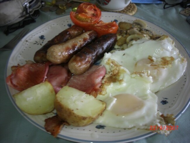 My European Breakfast. Danish Bacon, Irish Sausages and Potato,English Eggs, Polish Mushrooms and Dutch Tomatoes. Also known as the Cholesteral Special. Why is Cholesteral so delicious