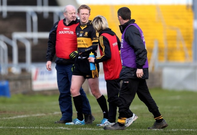 Colm Cooper leaves the field with an injury