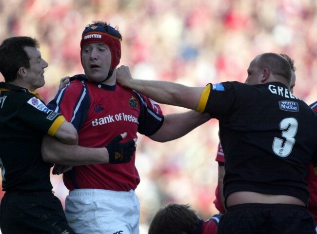 Rob Howley holds back Anthony Foley 25/4/2004