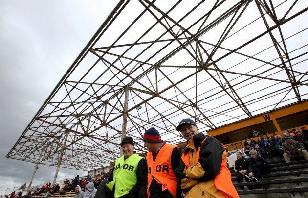 Stewards in discussion under the damaged stand in Nowlan Park before the game