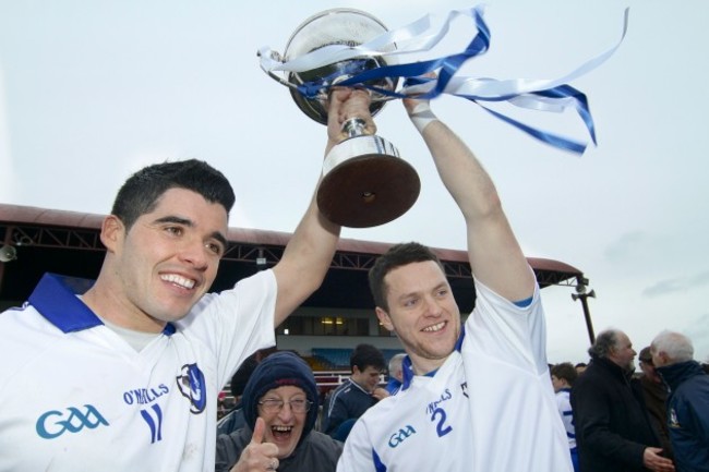 Football fan Joe Regan joins Emlyn Mulligan and Gary Reynolds for a photo as they left the trophy