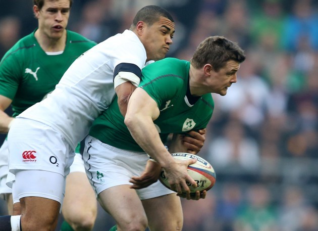 Brian O'Driscoll is tackled by Luther Burrell