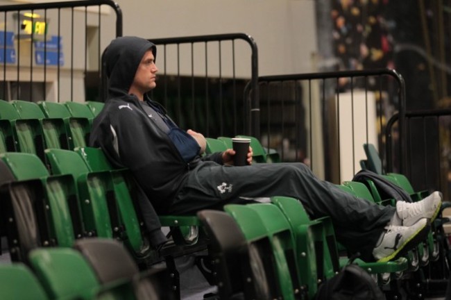 Irelands injured Jamie Heaslip looks on during the indoor training