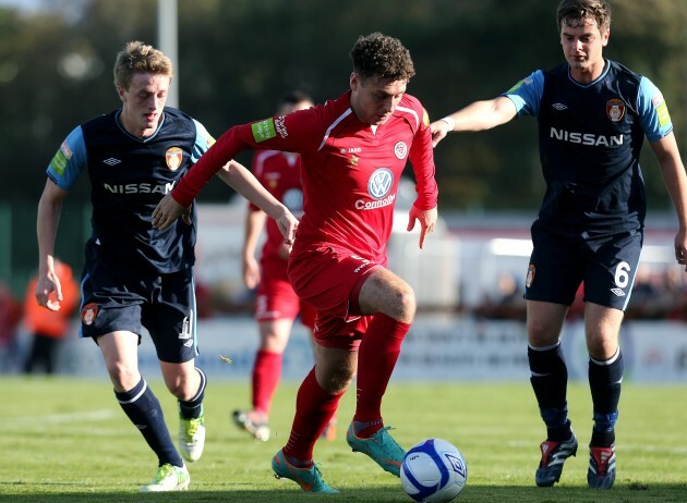 Mark Quigley tackled by Chris Forrester and Greg Bolger