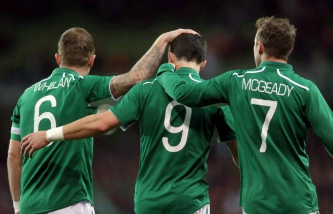 Shane Long celebrates scoring with Glenn Whelan and Aiden McGeady