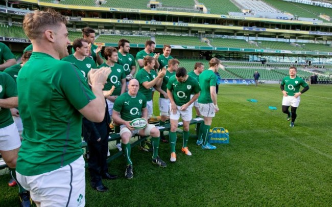 Brian O'Driscoll receives a round of applause from teammates as he arrives for the team photograph