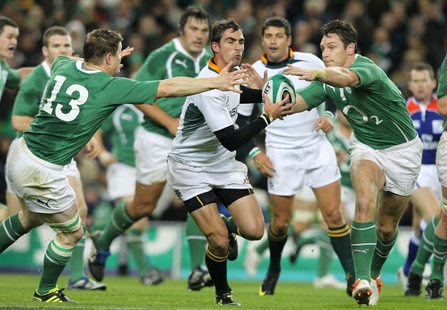 Ruan Pienaar tries to go past Brian O'Driscoll and David Wallace